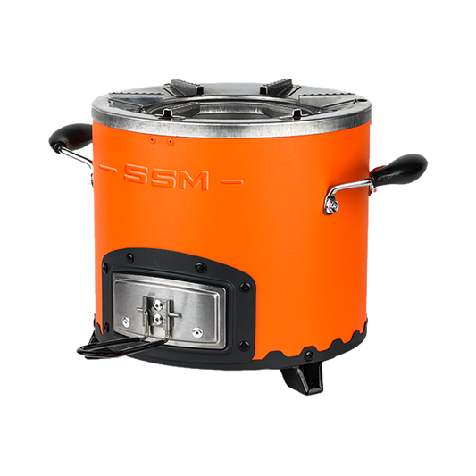 Three-quarter profile of the orange C26-12 clean cook charcoal stove, highlighting the high-efficiency design that uses 50% less fuel than three-stone cooking methods.