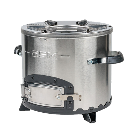 Three-quarter side angle of the C26-10B stainless steel charcoal stove, highlighting the heavy-duty metal fuel door and stable support legs that deliver 46% thermal efficiency.