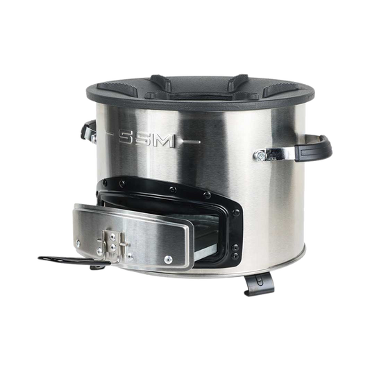 Three-quarter profile of the large-size C28-23SE clean cookstove, featuring a removable ash tray for firepower management and a durable cast iron top designed for high efficiency.