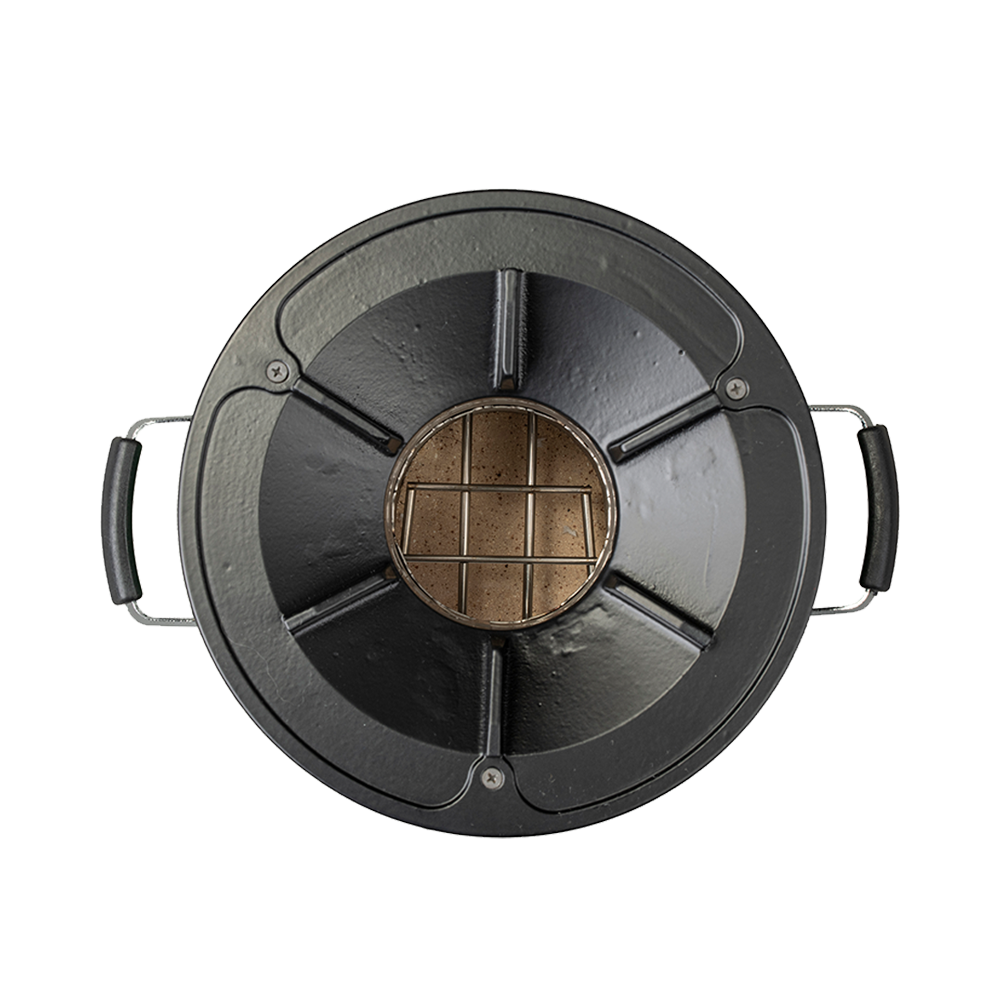 Top-down view of the green S26-13 stove, emphasizing its compact circular design.