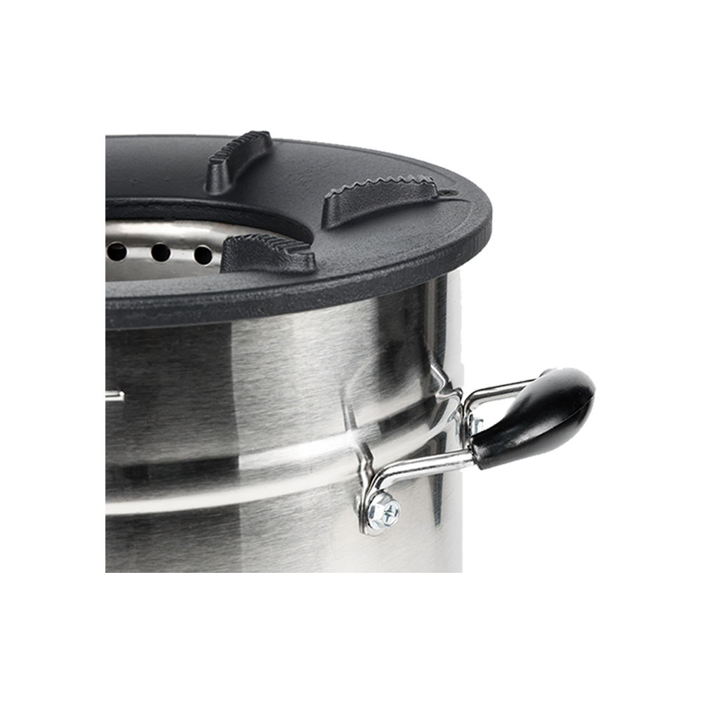 Close-up view of the cast-iron cooktop and secondary air ventilation system on the C28-23MAX charcoal stove, highlighting the high-efficiency design engineered for the fastest cooking performance.