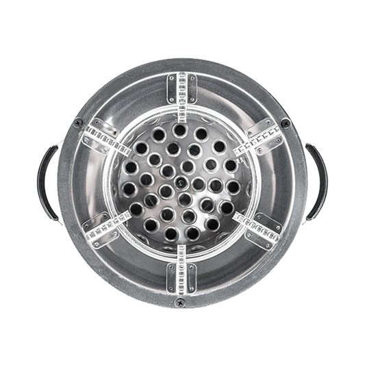 Top-down view of the C26-10B stainless steel charcoal stove combustion chamber, showcasing the secondary air vent pattern and integrated cooktop grates.