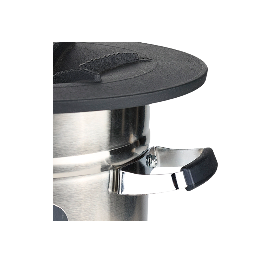 Detail view of the S32-X stainless steel body and handle, emphasizing a high-performance design that uses 50% less fuel than the traditional three-stone cooking method.