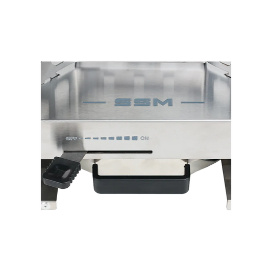 Close-up detail of the SSM brand logo and flame control sliding lever on the ES320 stainless steel ethanol stove, marking the adjustment scale from OFF to ON.